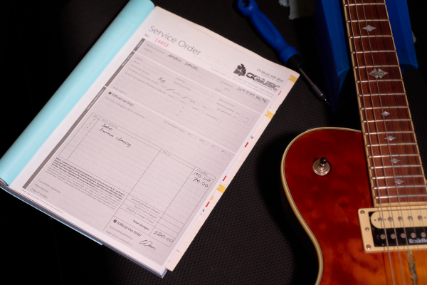 Transparent guitar service order with pricing details in Malaysia.