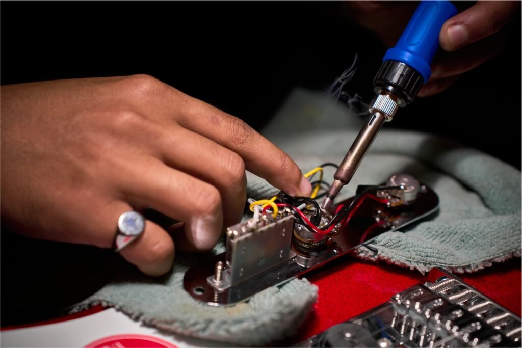 Guitar service workshop in Malaysia with tools and guitars at CK Music.