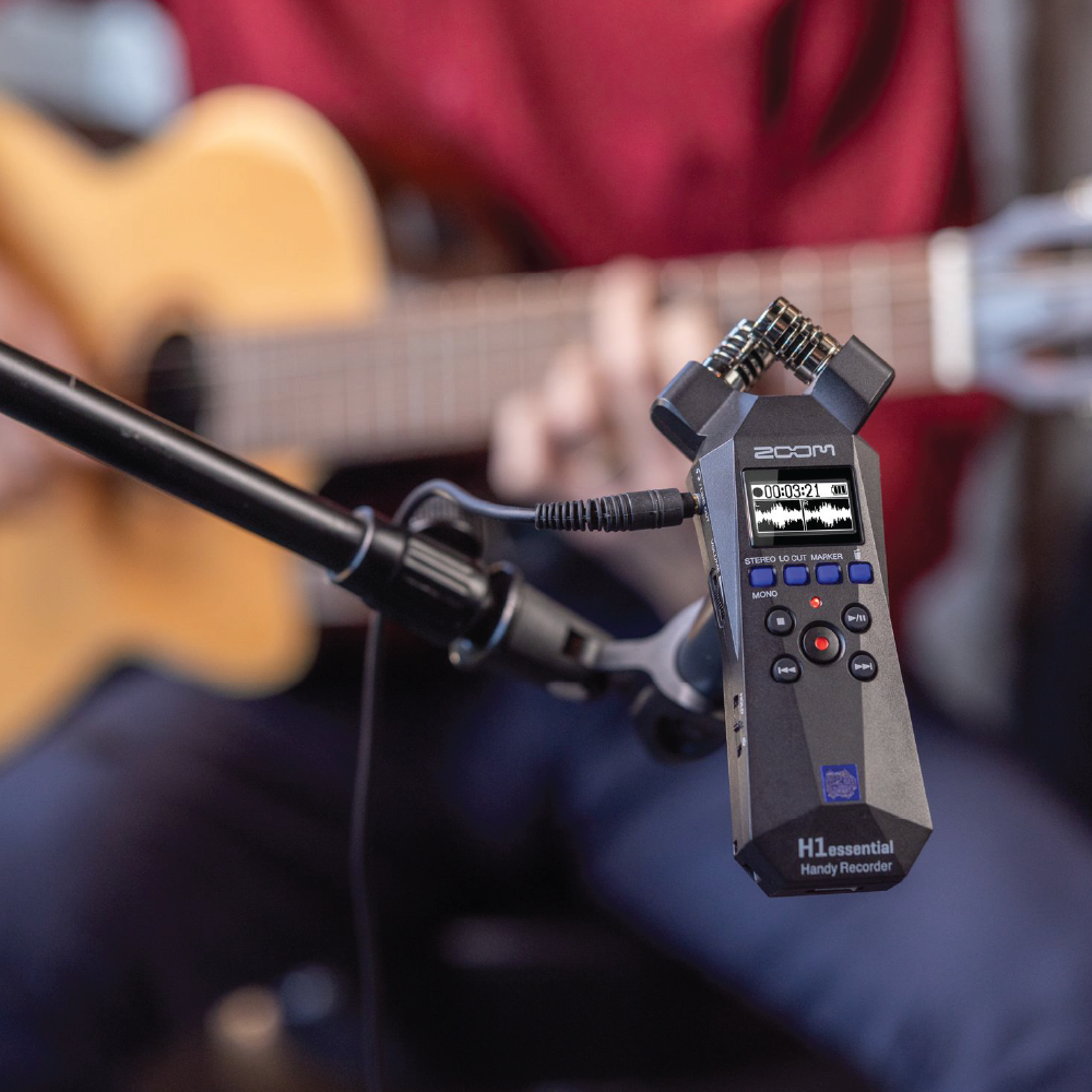Zoom H1essential 32-bit float recorder on mic stand recording acoustic guitar in Malaysia